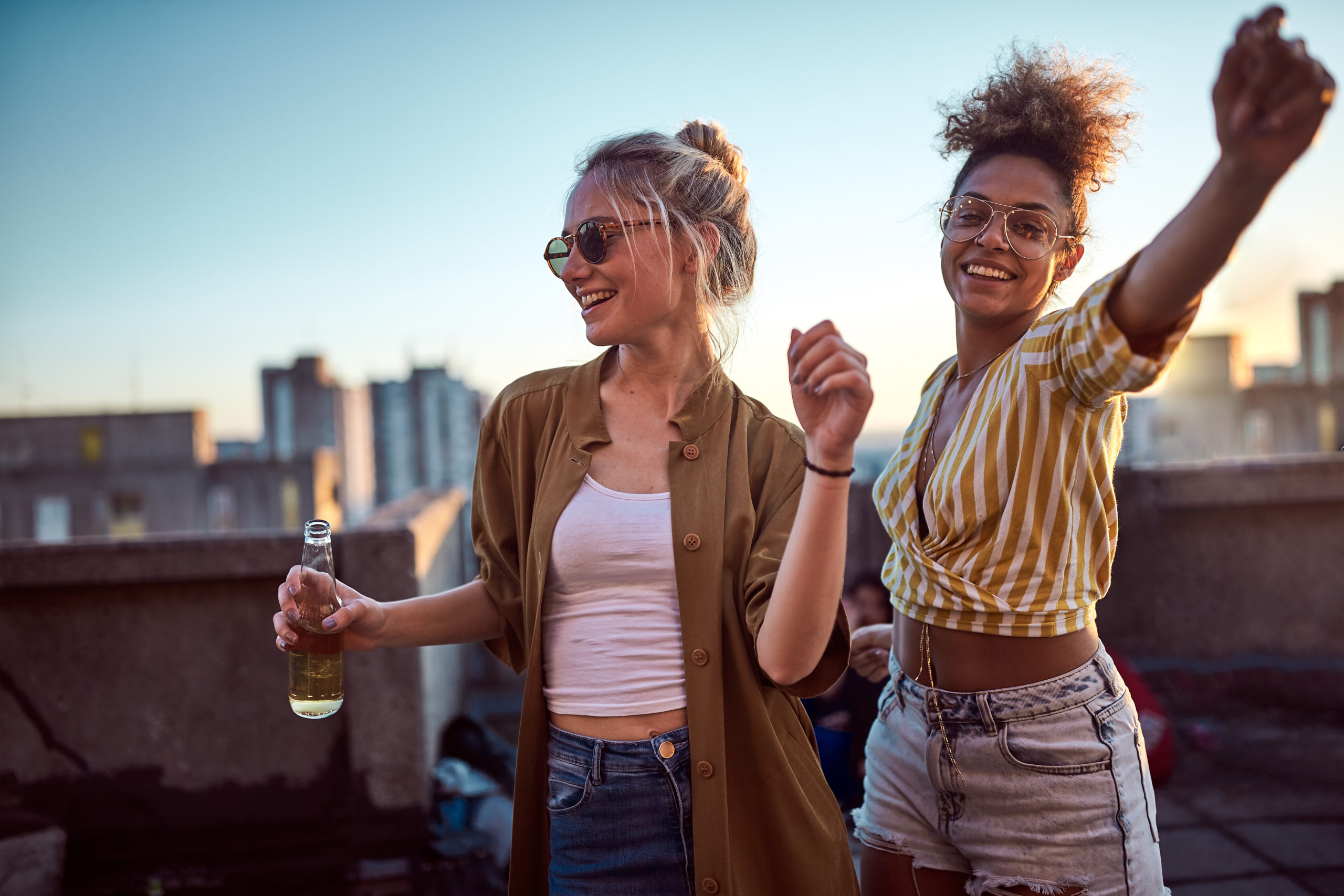 Two women dancing at the party.